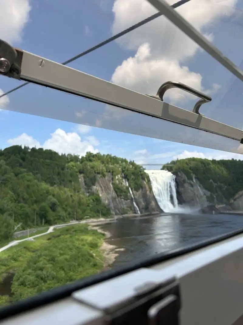 Ziplining Across The Waterfall At Montmorency Falls-Quebec-Canada